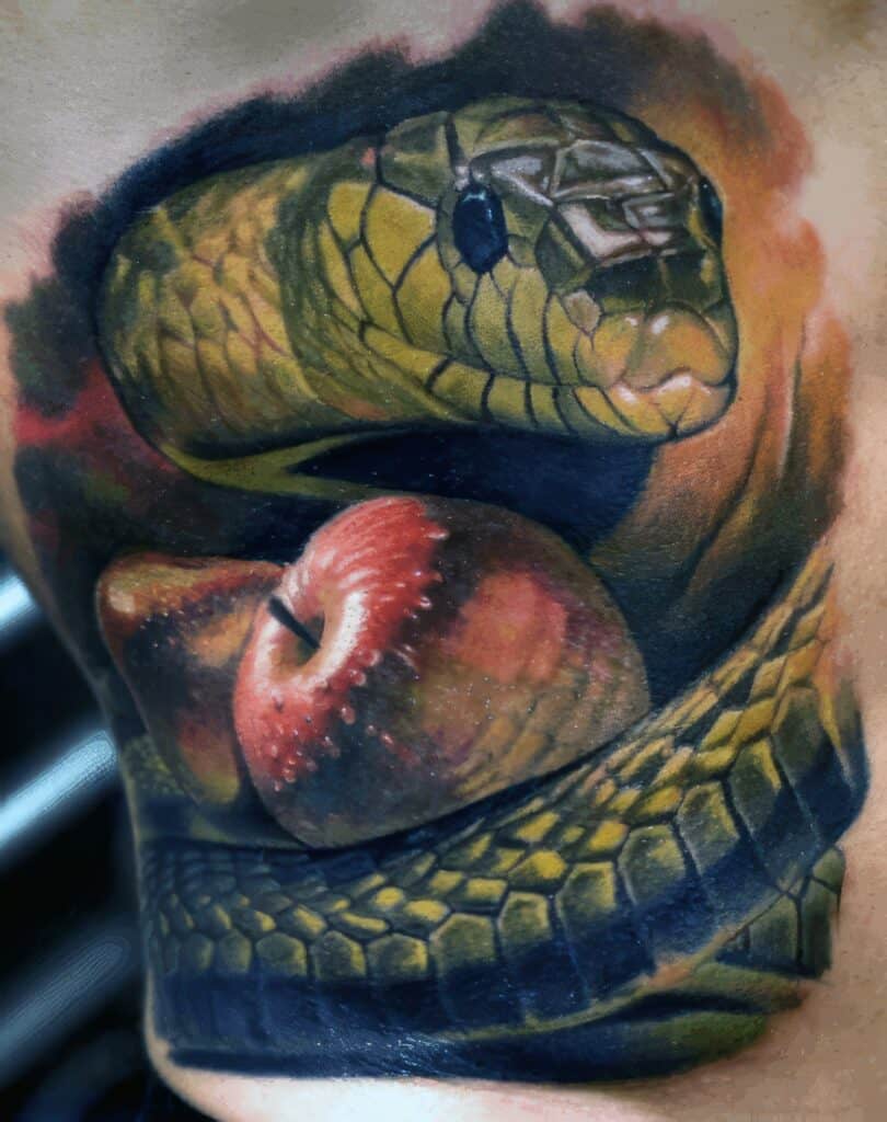 Micro-realistic snake tattoo with a 3d effect.